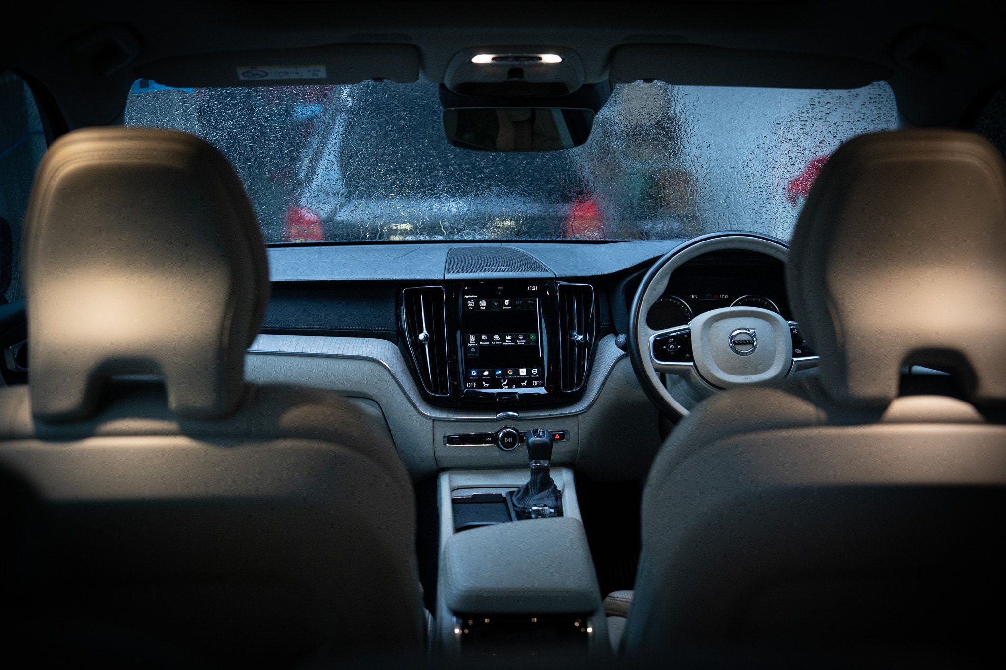 Spotless Volvo cabin with cream leather seats, photographed from the back seat after a Prime detail